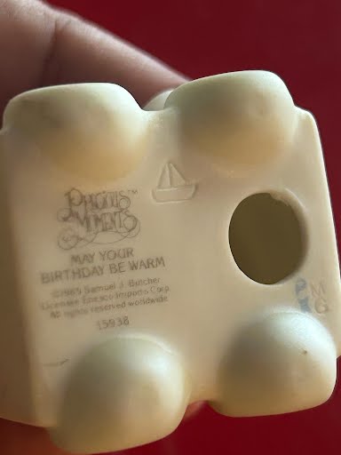 Precious Moments figurine "May Your Birthday Be Warm"
