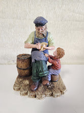 "Carving boat for boy" Statue